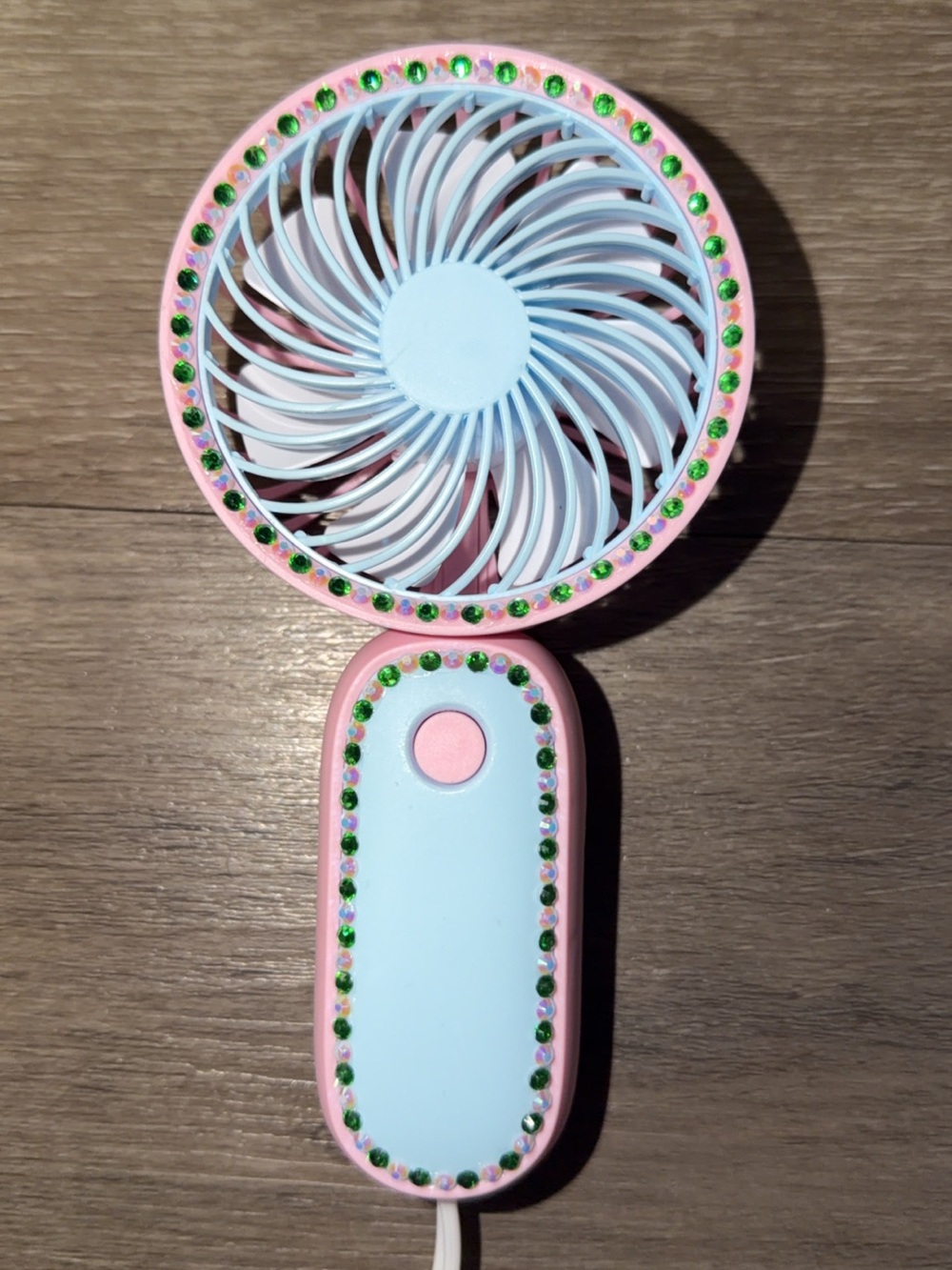 pink & blue handheld fan with green and white rhinestones